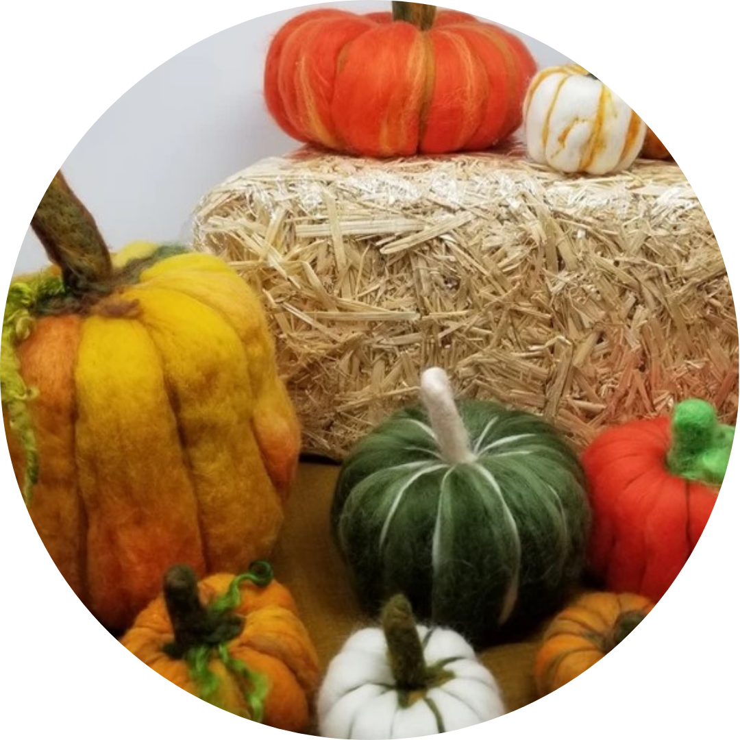 Image of brightly colored pumpkins made of felt